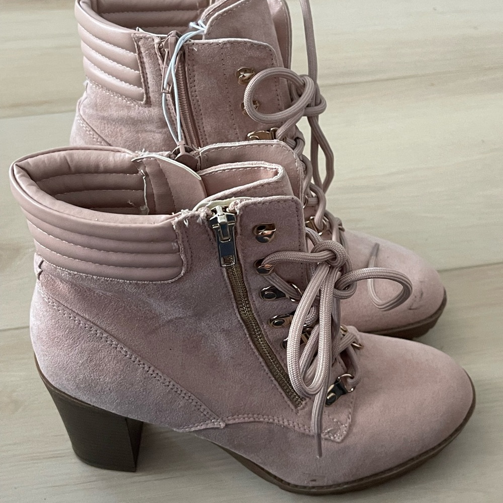 Size 8.5 pink boot with gold hardware. Never worn.